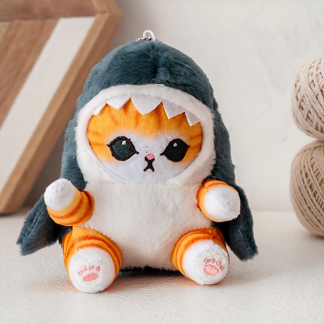 Bambola di peluche piccolo gatto travestito da squalo