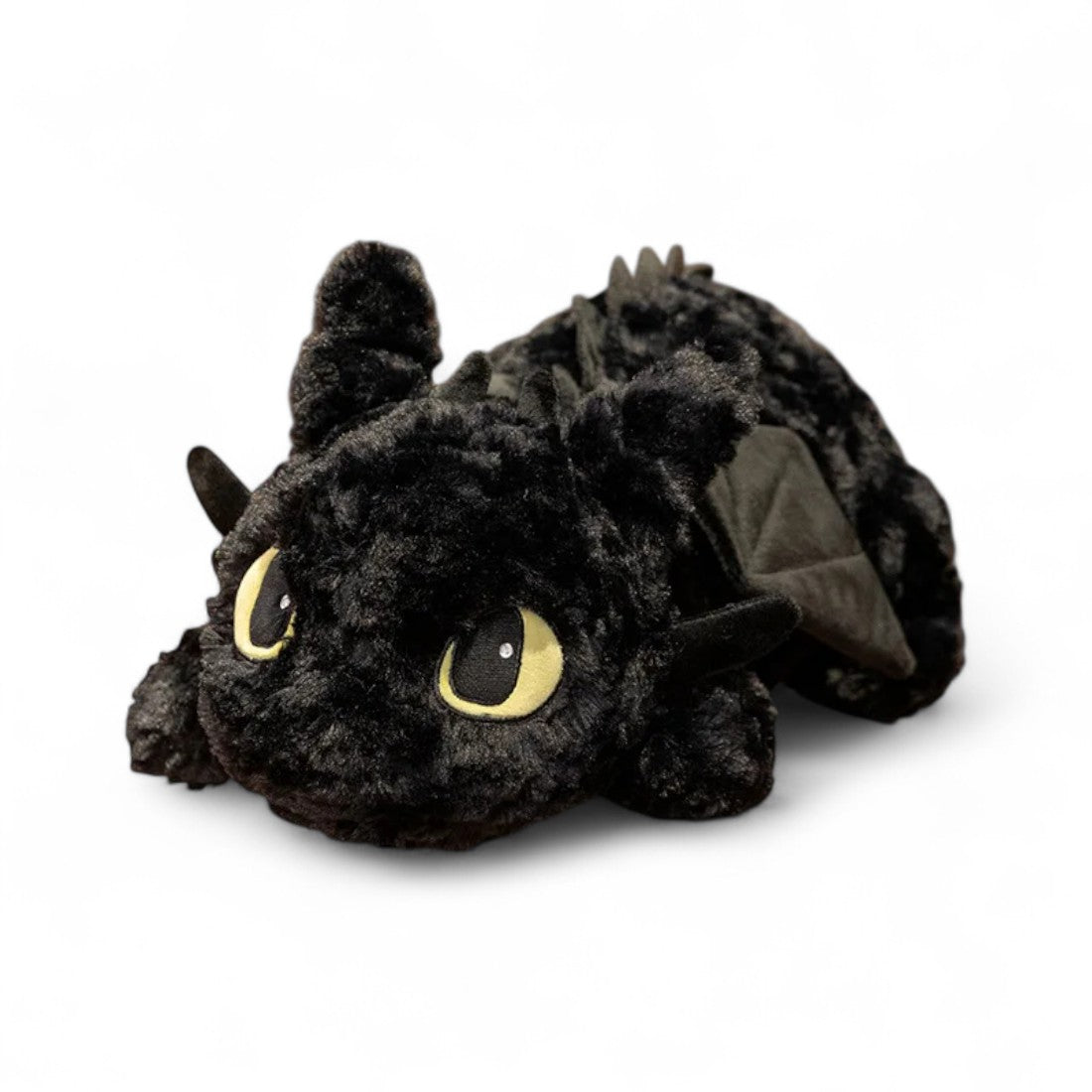 Peluche nero Sdentato della saga Dragon Trainer DreamWorks, morbidissima, su sfondo bianco.