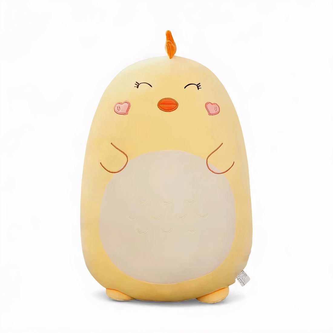 Grande cuscino peluche pulcino giallo, 45 cm, pancia crema, occhi chiusi, guance a forma di cuore e piccolo becco arancione, appoggiato su un divano chiaro.