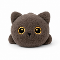 Peluche gatto nero disteso con grandi occhi - Sfondo bianco frontale