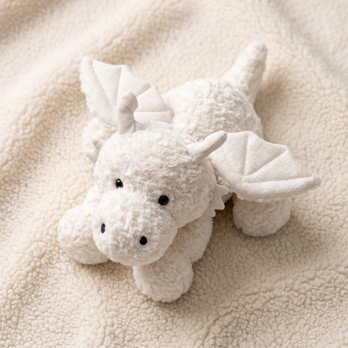 Peluche drago bianco con ali - Dettaglio del materiale